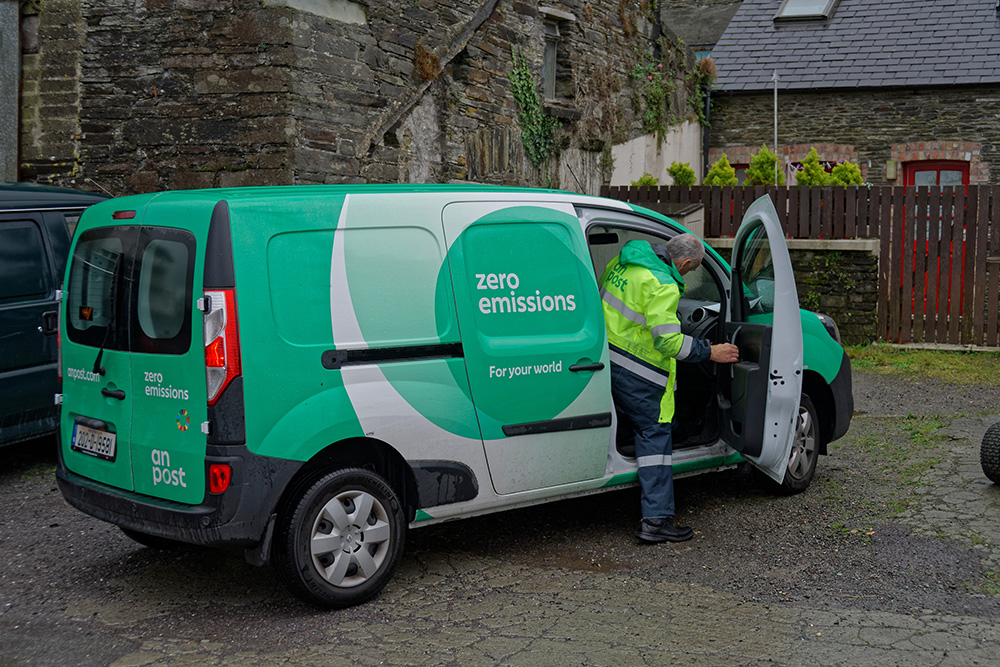 Green and white post van parked in Skibbereen.