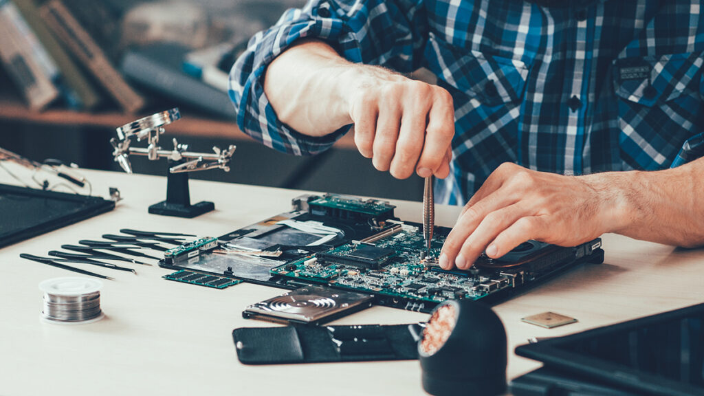 People fixing various items at Repair Café