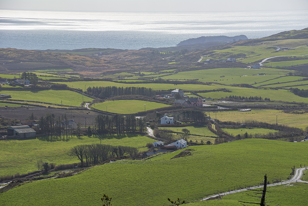 Aerial shot of Skibbereen's picturesque landscape, showcasing the lush greenery and unique topography near Lisheens House.